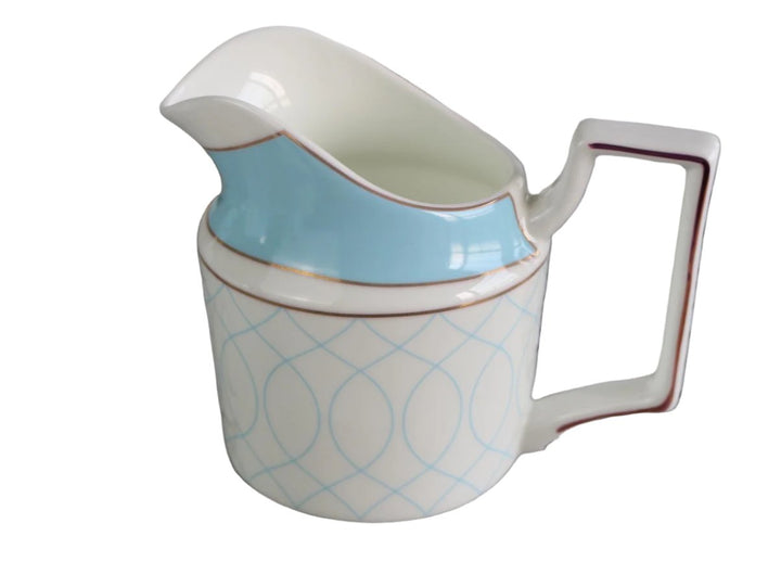 Light blue and white milk jug with gold accents, part of a bone china tea set.